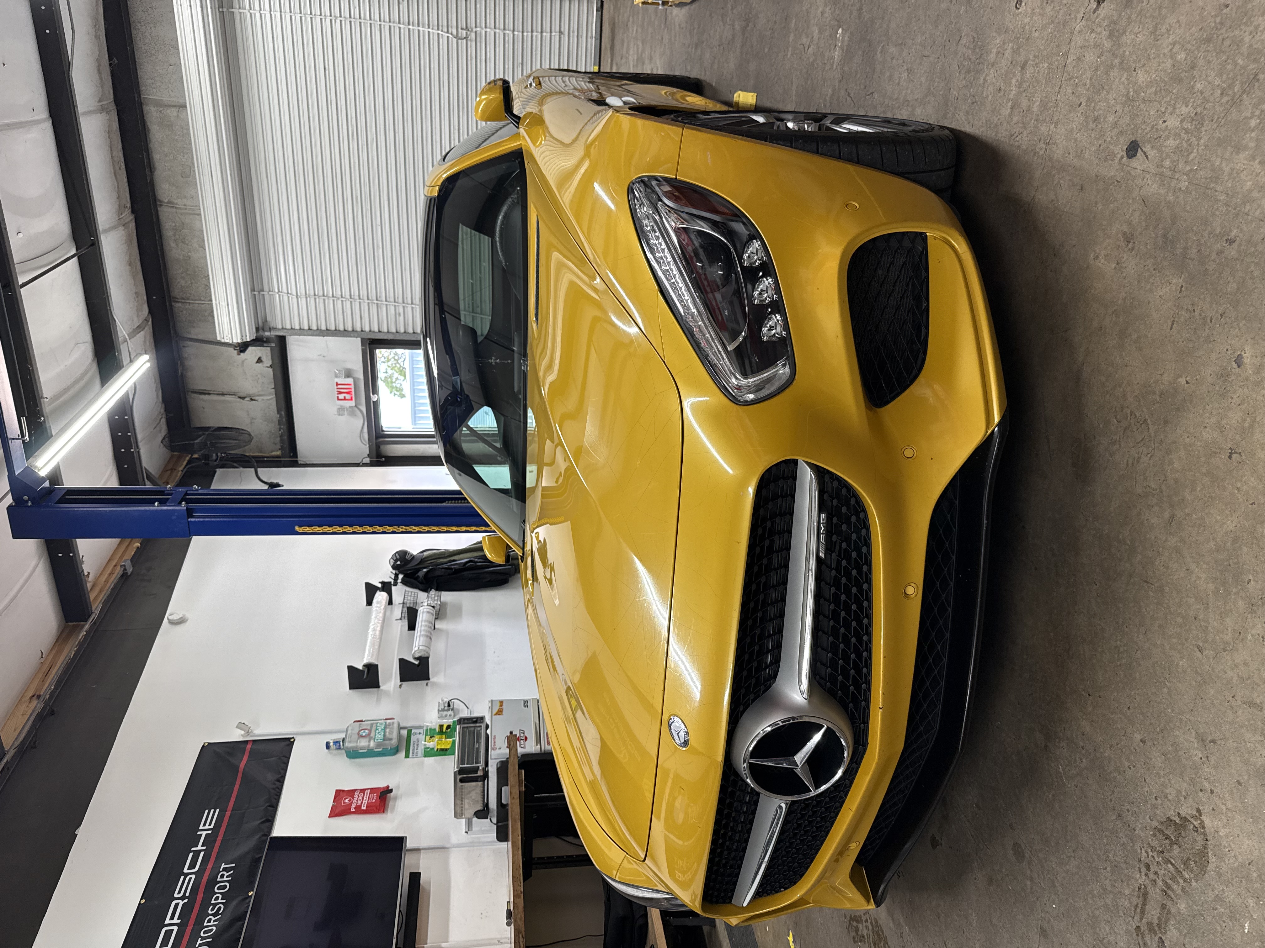 Yellow Mercedes-AMG in the service bay at Dolan’s Garage