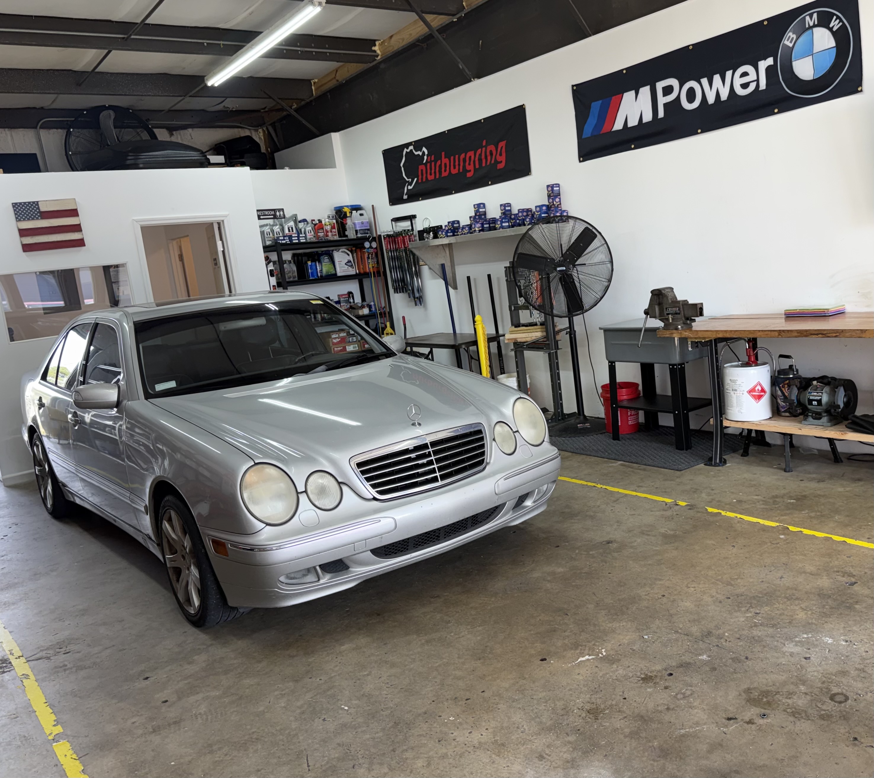 Silver Mercedes-Benz sedan inside Dolan’s Garage